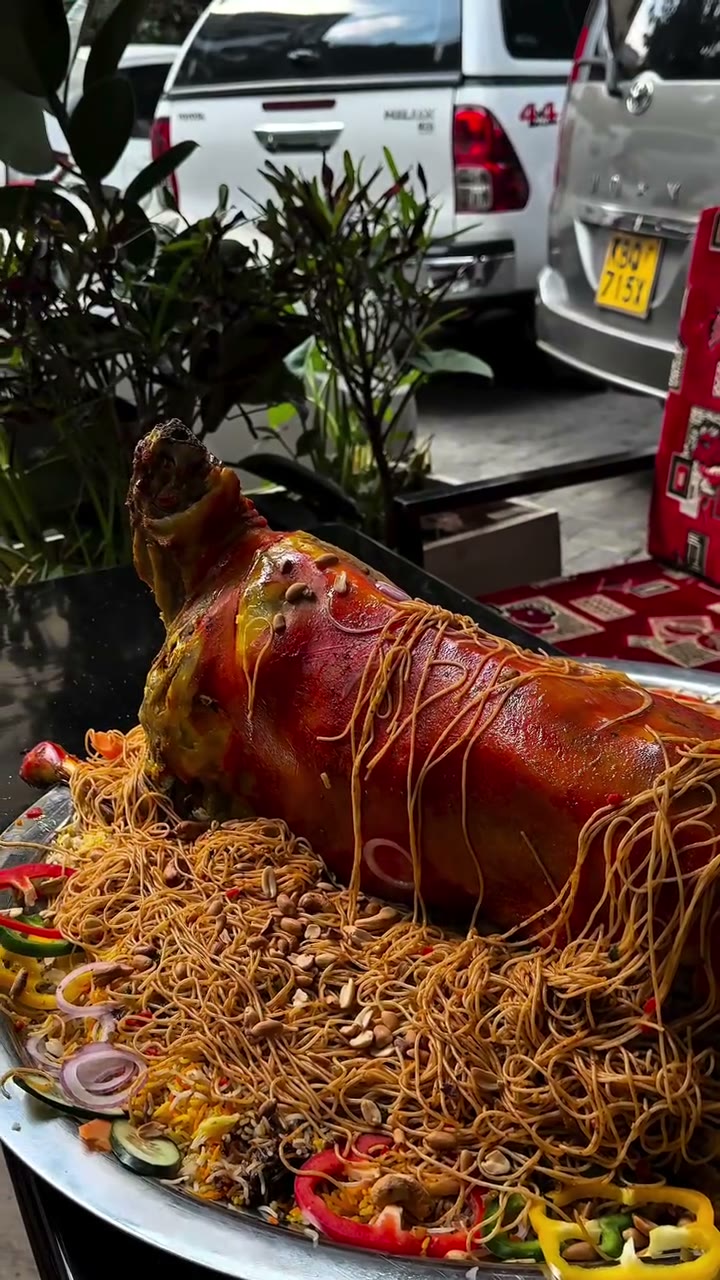 Whole roasted goat on spiced vermicelli rice