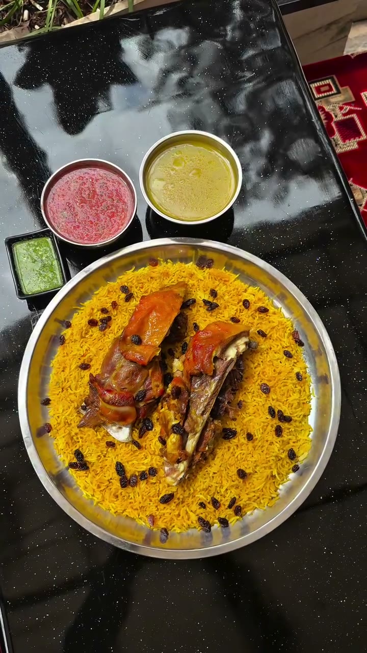 Lamb mandi with saffron rice and raisins